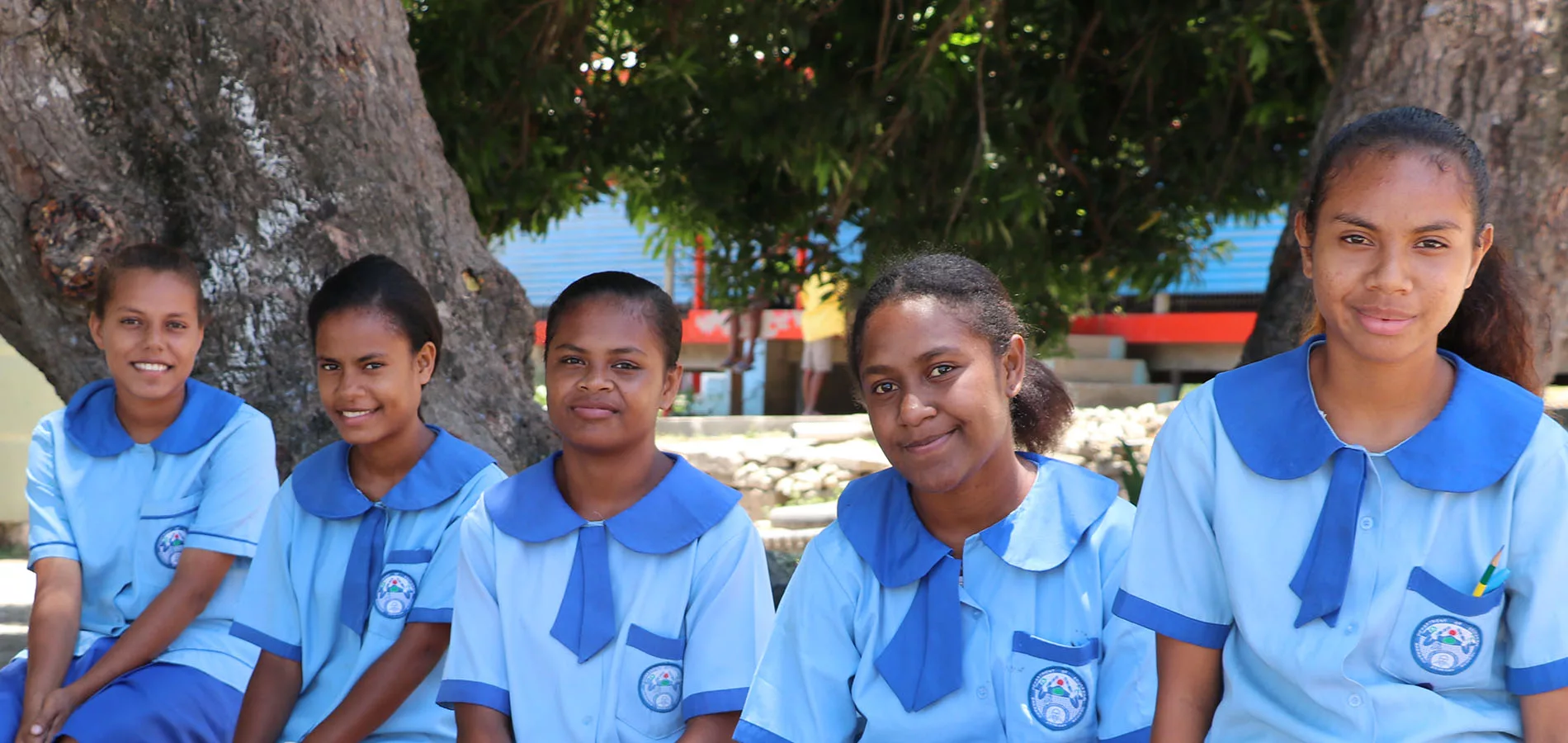 Timorese school girls in blue uniforms