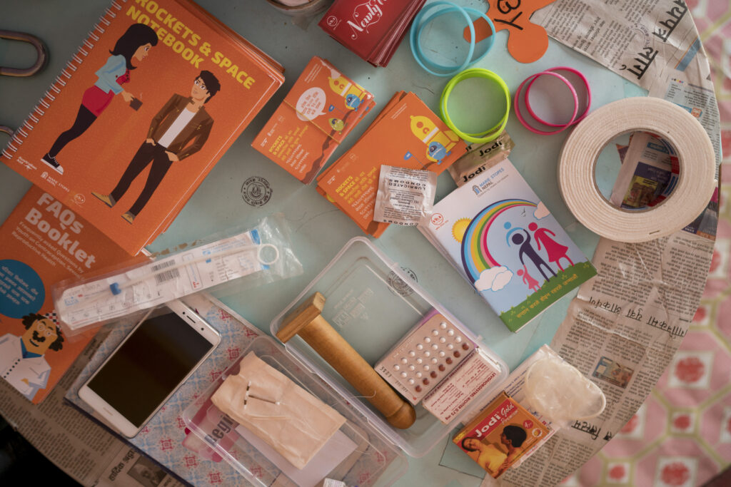 Materials used to educate young people on contraception are laid out on a table at a youth club in Bhaktapur.